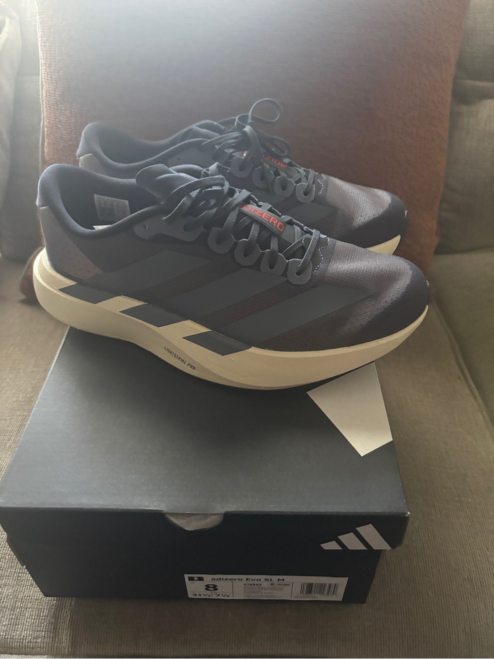 adidas Men's Black and Cream Athletic Running Shoes with Subtle Red Accents